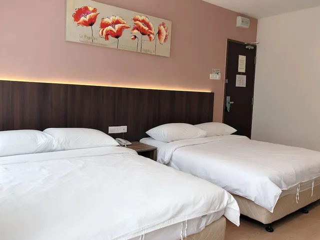 غرفة ديلوكس رباعية بسريرين كوين، Tumike Hotel 2/3