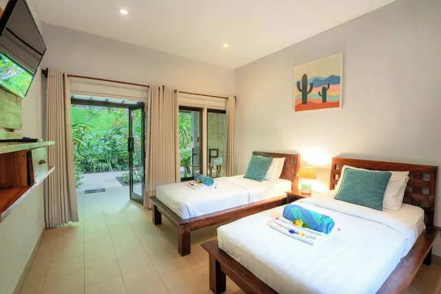 غرفة بسريرين منفصلين بإطلالة على الحديقة، Bale Sampan Bungalows 10/10