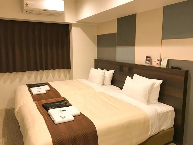 غرفة بسريرين منفصلين للمدخنين، Hotel Livemax Premium Sapporo Odori Park 1/6
