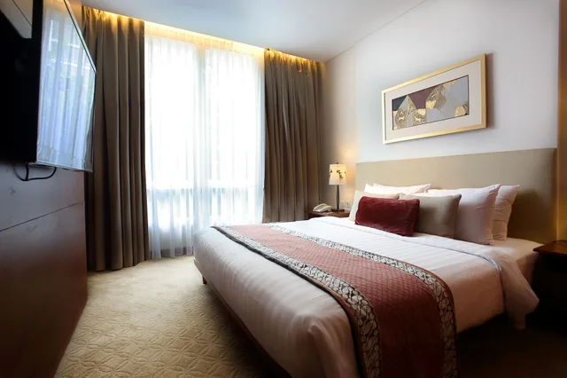 جناح بسرير كوين وسرير فردي، Jambuluwuk Malioboro Hotel Yogyakarta 1/6