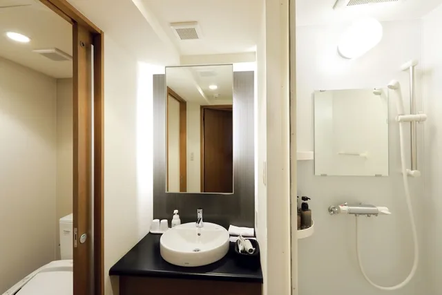 غرفة يابانية غربية عصرية بسريرين منفصلين وفرشتي فوتون، Sounkyo Onsen Choyo Resort Hotel 2/2