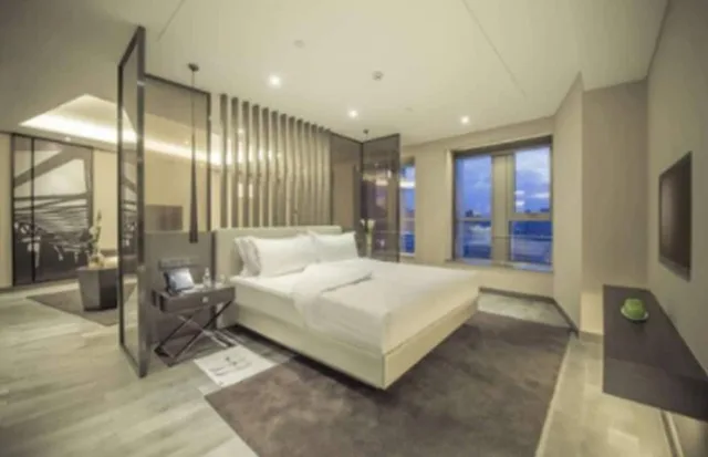 غرفة ديلوكس بسرير كينج بإطلالة على المدينة، Pan Pacific Tianjin 3/5
