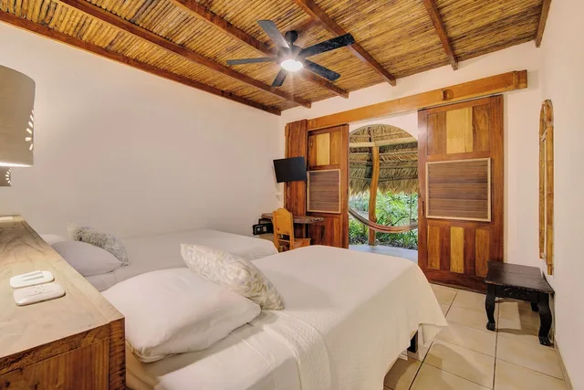 غرفة اقتصادية بسرير كوين وسرير فردي، Cariblue Beach Jungle Resort 1/10