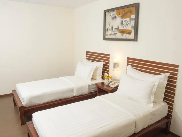 غرفة بسريرين منفصلين بحمام مشترك، d primahotel Melawai Blok M 4/5