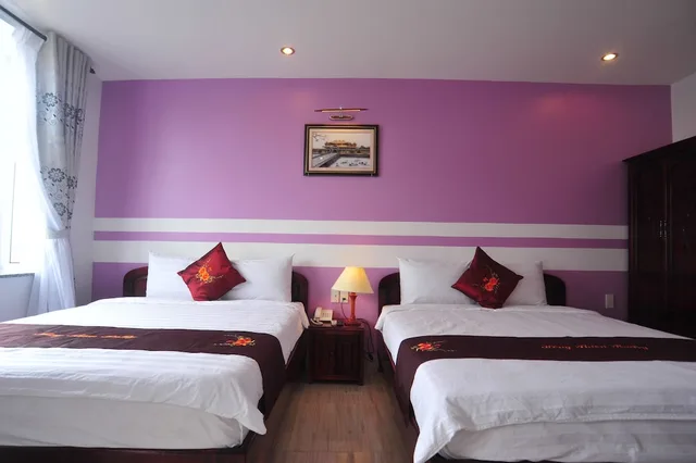 غرفة ديلوكس ثلاثية بسرير مزدوج وسرير فردي بشرفة، Hong Thien Ruby Hotel 1/2