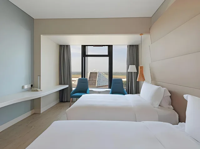 غرفة بريميير ديلوكس بسريرين منفصلين، Garden Lane Meilan Airport Hotel Formerly Haikou Meilan Airport Hotel 1/1