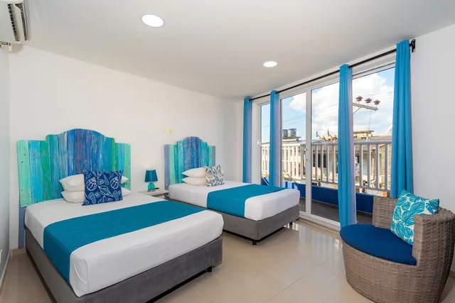 جناح رئاسي بسرير كينج بـ3 غرف نوم، White Coral Apartasuites 1/4