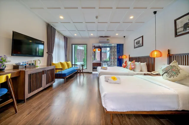 غرفة فاخرة ثلاثية بسرير كوين وسرير فردي، Son Trang Hotel Hoi An 1/2