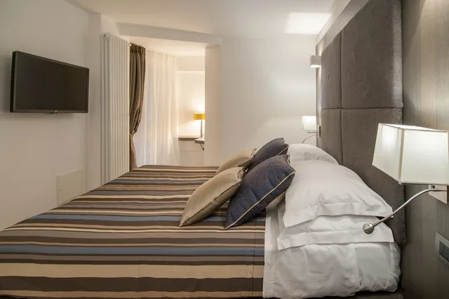غرفة بسرير مزدوج أو سريرين منفصلين، Wellness Home Rome 1/5