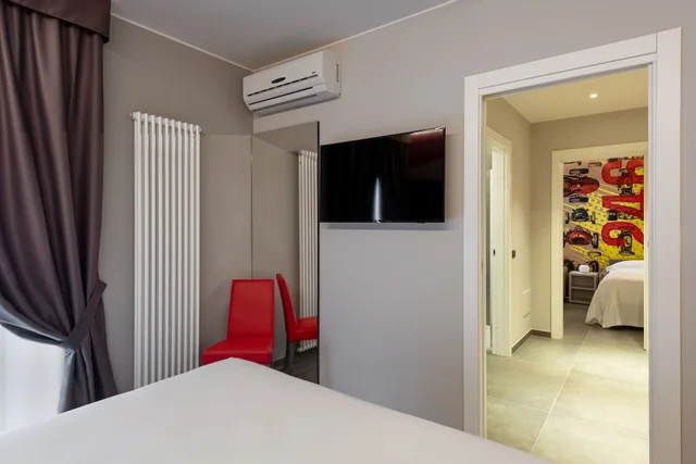 غرفة ديلوكس رباعية بسرير كوين مع أريكة، Maranello Village 3/4