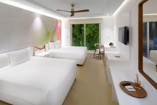 غرفة ديلوكس رباعية بسريرين مزدوجين بشرفة، Antera Hotel and Residences 2/2
