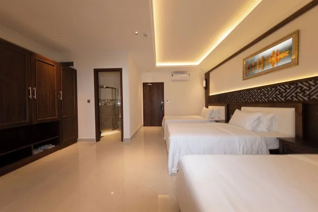 غرفة ديلوكس ثلاثية بثلاثة أسرّة بإطلالة على الحديقة بغرفة نوم واحدة، MerPerle Nui Sam Resort 1/2