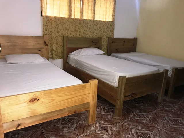 غرفة قياسية رباعية بسرير مزدوج وسريرين منفصلين، Plaza Real Resort 2/3