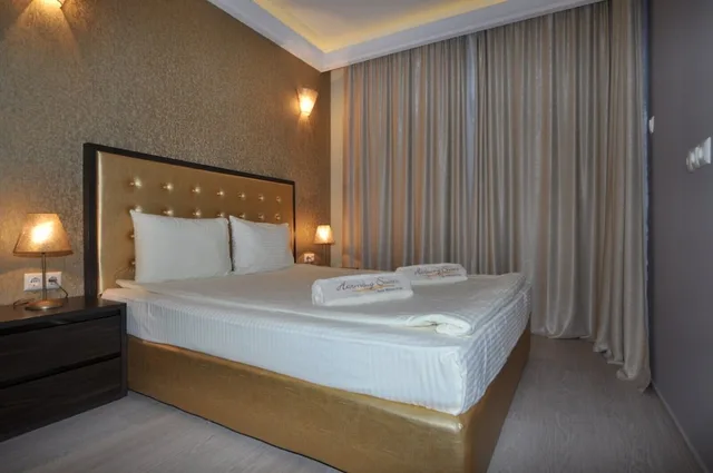 شقة ديلوكس بسريرين كوين بغرفتي نوم مع أريكة، Harmony Suites 2 3 2/4