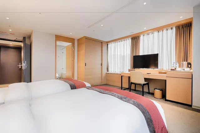 غرفة ديلوكس بسريرين منفصلين بحوض استحمام، Green World Hotel Grand Nanjing 1/5