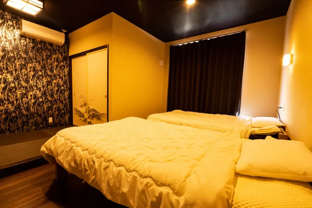 غرفة يابانية ثلاثية بفراش فوتون وسريرين منفصلين بحمام مشترك، Guest House Ouka - Hostel 3/6