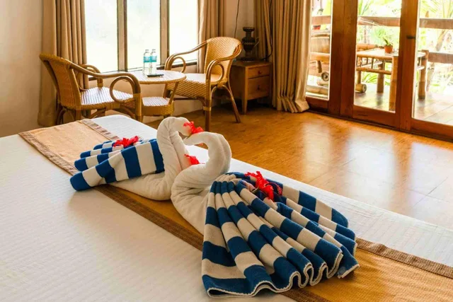 غرفة عائلية بسرير كينج وثلاثة أسرّة بإطلالة على الحديقة، Romantic Beach Villas 1/1