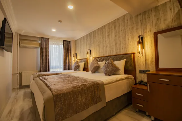 غرفة ثلاثية بسرير مزدوج وسرير فردي، Avrasya Port Hotel 1/3