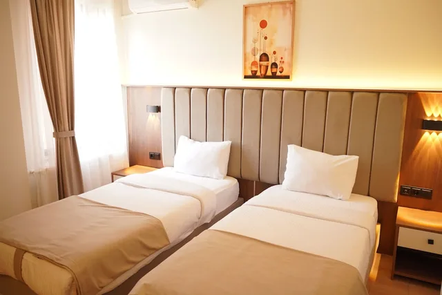 غرفة قياسية بسريرين منفصلين، Lion City Hotel 1/10