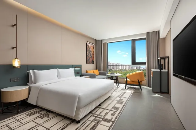 غرفة بزنس بسرير كينج، Days Hotel by Wyndham Haikou Meilan Airport 1/2