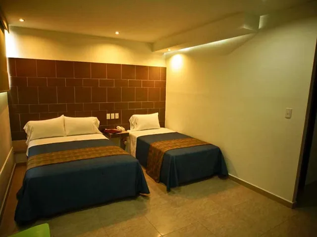 غرفة عائلية بسرير كينج وسرير فردي، First Inn Hotel and Business 1/10
