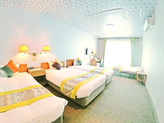 غرفة عائلية بسريرين منفصلين مع أريكة، Hotel Caretta Amami 3/3
