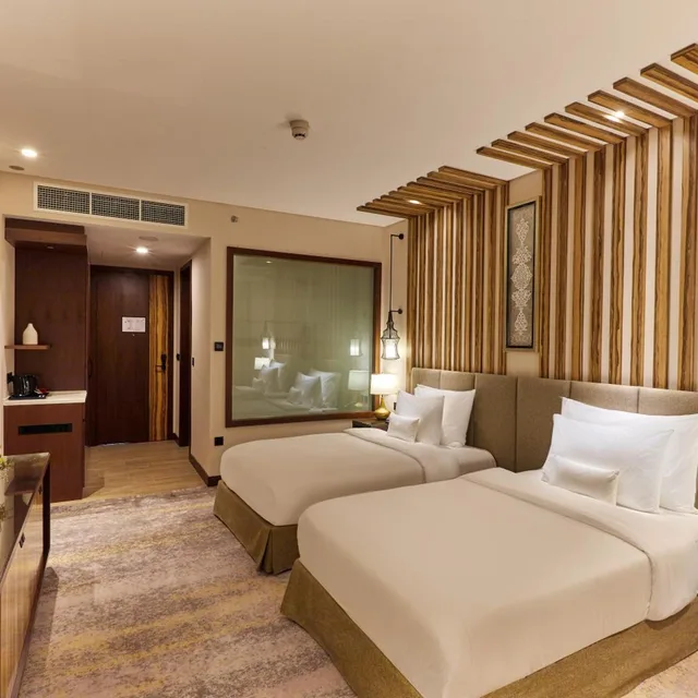 غرفة ديلوكس بسريرين منفصلين، Millennium Resort Salalah 1/5