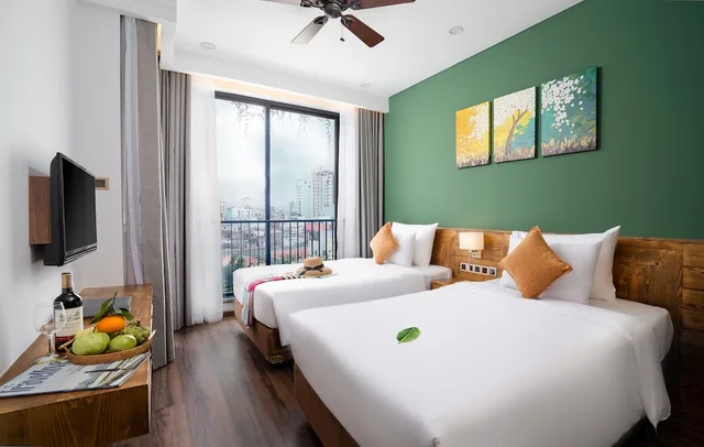 شقة ديلوكس بأربعة أسرّة بشرفة بغرفتي نوم، Chi House Danang 1/2