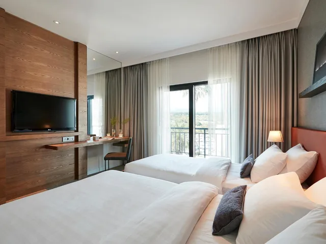 غرفة ديلوكس عائلية بسرير مزدوج وسرير فردي، The Suites Hotel Jeju 1/2