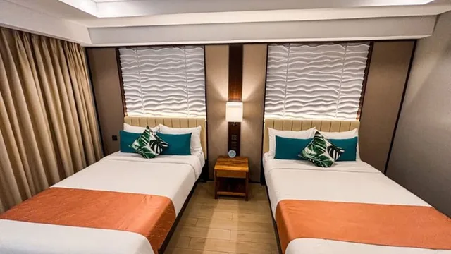 غرفة ديلوكس رباعية بسريرين مزدوجين، Puerto De San Juan Beach Resort Hotel 3/3