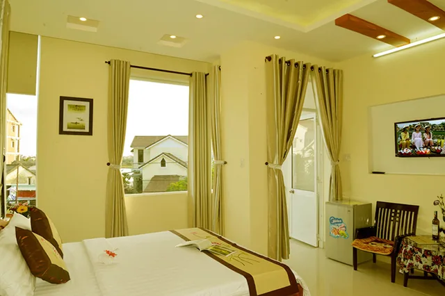 غرفة ديلوكس ثلاثية بسرير مزدوج وسرير فردي بإطلالة على الحديقة، Bamboo Garden Homestay 2/2