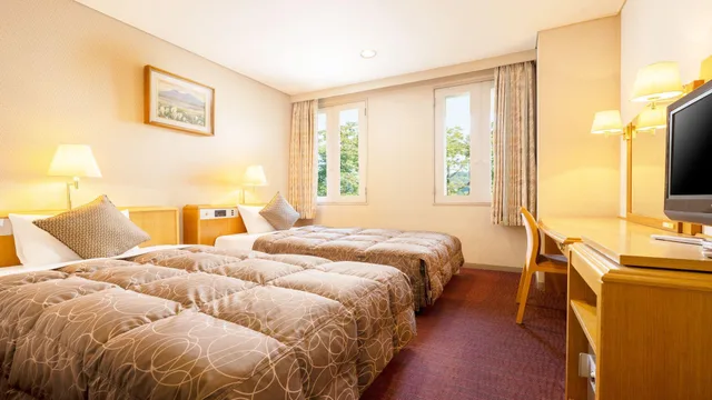 غرفة بسريرين منفصلين بحوض استحمام، Kamenoi Hotel Fukui 1/1