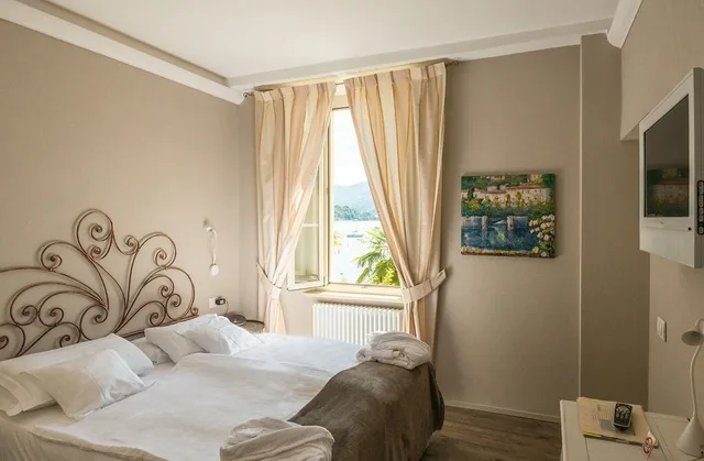 غرفة سوبيريور بسريرين منفصلين بإطلالة على البحيرة، Relais Villa Porta 2/6
