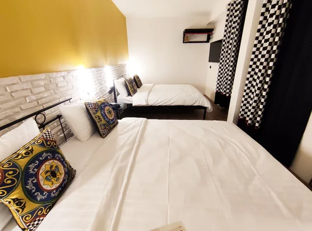 غرفة قياسية رباعية بسريرين كوين، Think Hotel 6/9