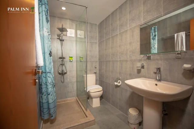 غرفة مفردة بسرير كوين، Palm Inn Hotel 7/9