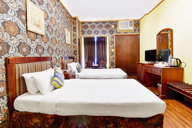 غرفة بسريرين منفصلين، Capital O 125 Moon Plaza Hotel 3/5