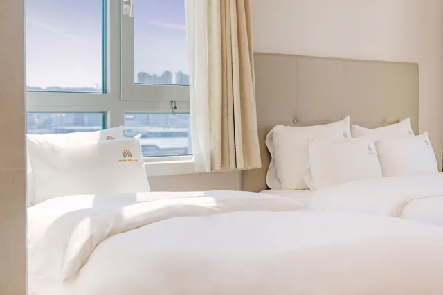 غرفة ديلوكس عائلية بسريرين منفصلين وسرير مزدوج وسرير فردي بإطلالة على المدينة، Central Park Hotel Busan 8/10