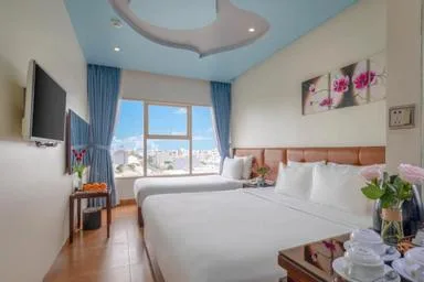 غرفة ديلوكس بسرير كينج بإطلالة جزئية على البحر، ANFADA Hotel Danang 1/1