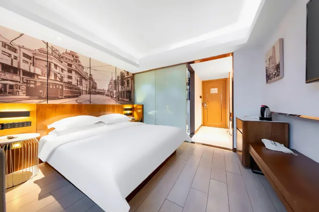 غرفة ديلوكس بسرير كوين، Metropolo Jinjiang Hotels Shanghai Hongqiao National Exhibition Center 2/2