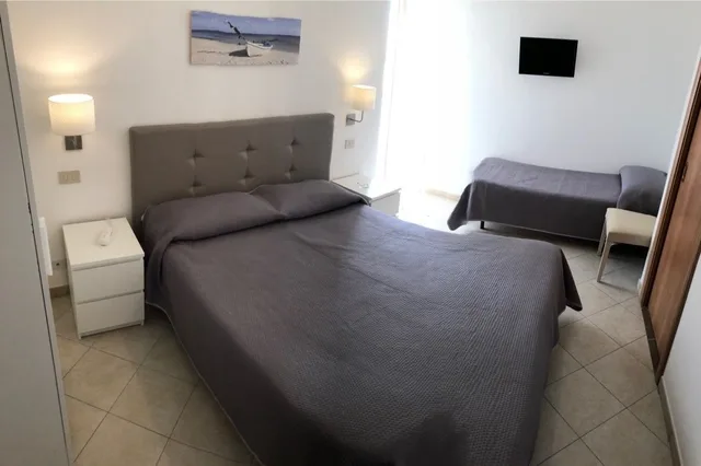 غرفة قياسية ثلاثية بسرير كوين وسرير فردي، Elios Hotel 1/6