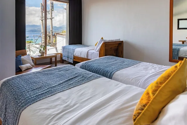 غرفة ثلاثية بثلاثة أسرّة بإطلالة على البحر، Pesona Beach Resort Spa 3/10