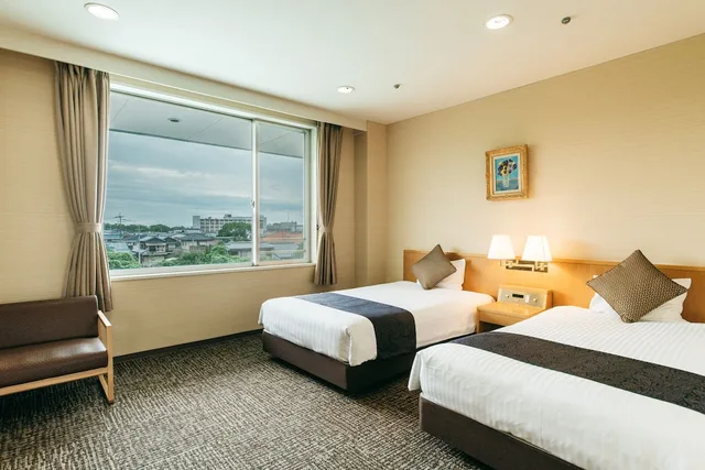 غرفة يابانية غربية بسريرين منفصلين وفرشتي فوتون بحوض استحمام، Kamenoi Hotel Yanagawa (ex Kanpo no Yado Yanagawa) 1/4