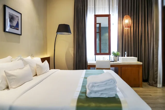 جناح جونيور بسرير مزدوج بمنطقة جلوس، G Mekong Hotel 3/7
