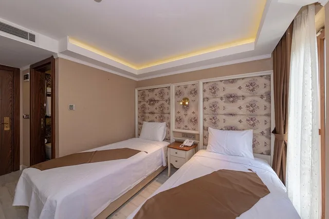 غرفة عائلية ثلاثية بسرير كينج وسرير فردي بإطلالة على المدينة، Sultan City Hotel 1/10