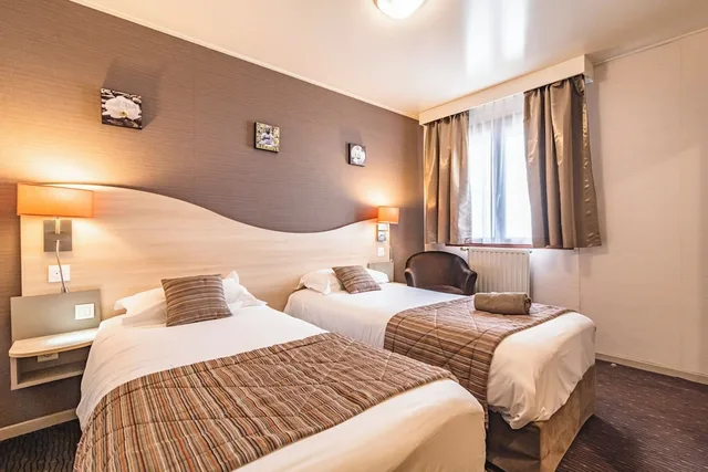 غرفة بسريرين منفصلين، Hotel Au Tambour 1/10