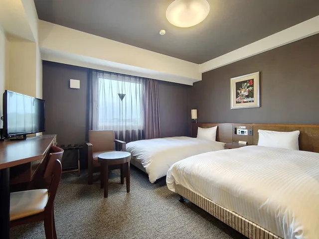 غرفة بسريرين منفصلين في المبنى الرئيسي للمدخنين، Hotel Route-Inn Iwakiizumi Ekimae 4/10