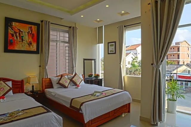غرفة ديلوكس ثلاثية بسرير مزدوج وسرير فردي بإطلالة على الحديقة، Bamboo Garden Homestay 1/2