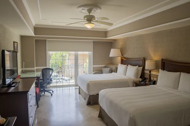 غرفة بسريرين مزدوجين بشرفة، Villa Mercedes Merida, Curio Collection by Hilton 1/1