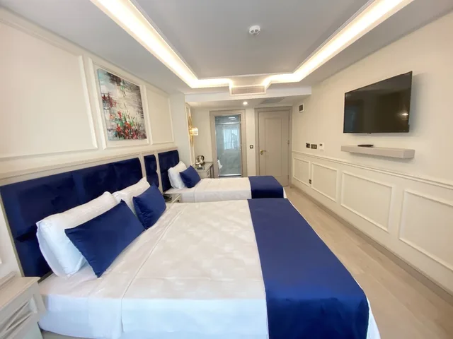 غرفة ديلوكس ثلاثية بسرير مزدوج وسرير فردي، Omma Hotel 3/4