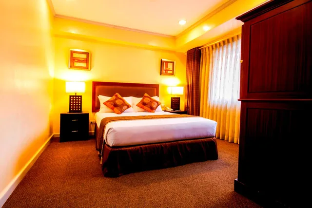 غرفة ديلوكس بسرير كوين، AIM Conference Center Manila 1/1